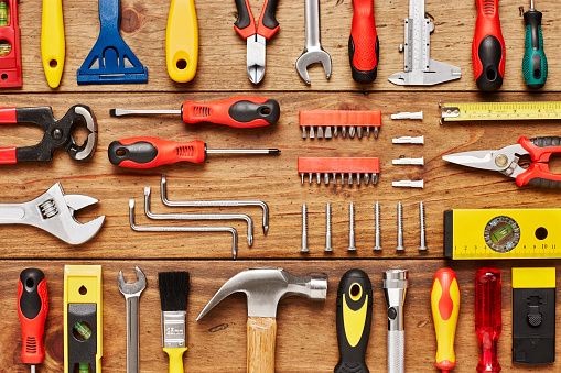 Flooring tools laid out on a timber workbench