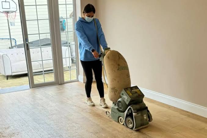 Floor preparation underway in a cleared room before finishing